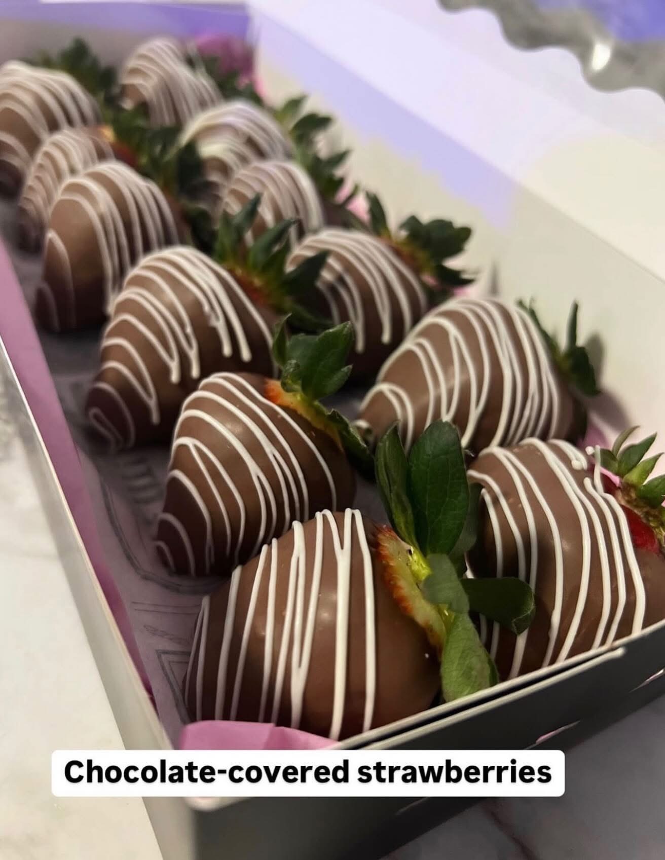 Box of chocolate covered strawberries with white drizzle